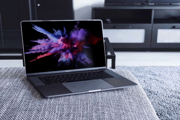 MacBook Pro on Couch Mockup